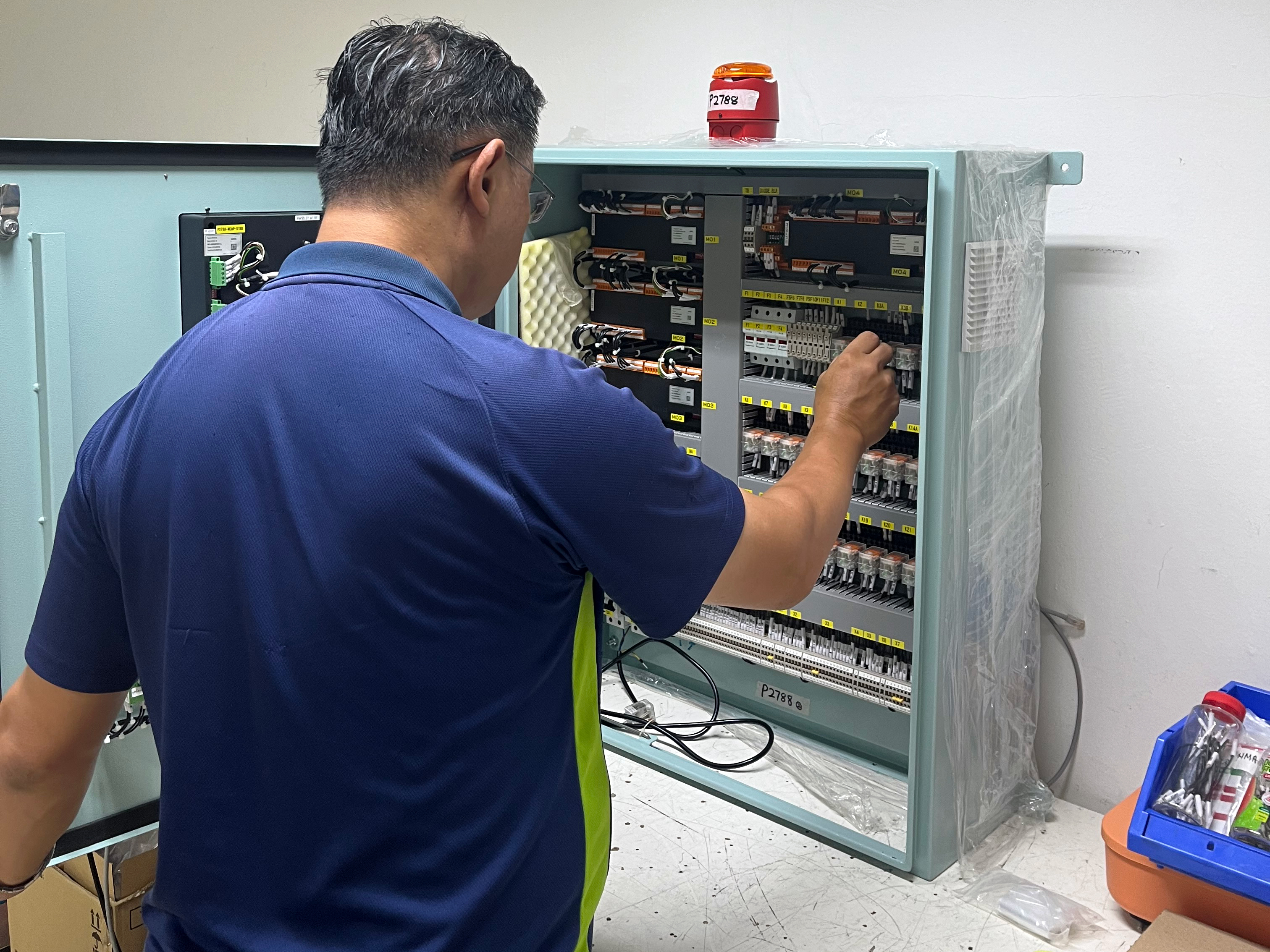 The image shows a Service Technician of Noris Automation Far East