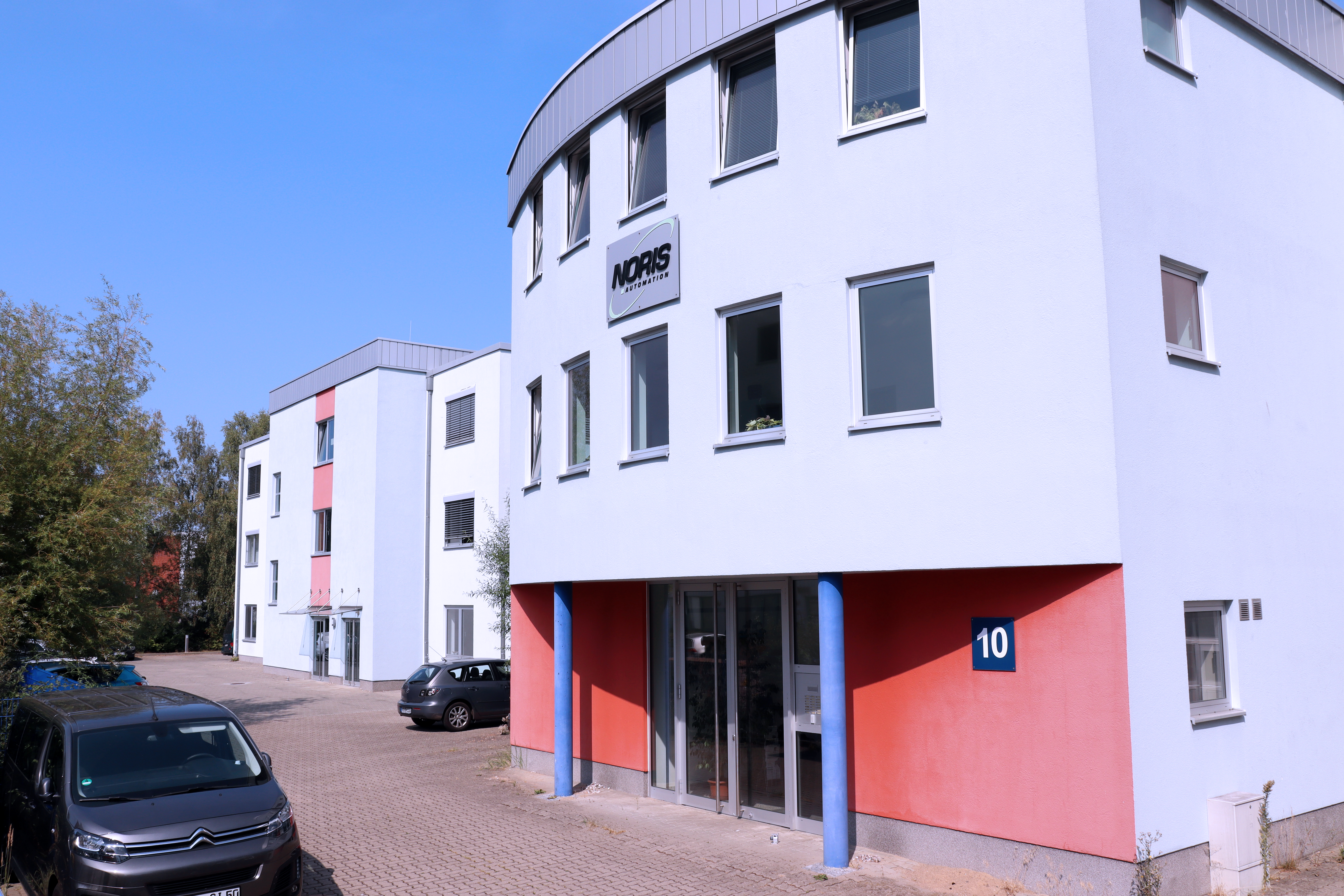 The image shows the company buildings of Noris Automation Rostock
