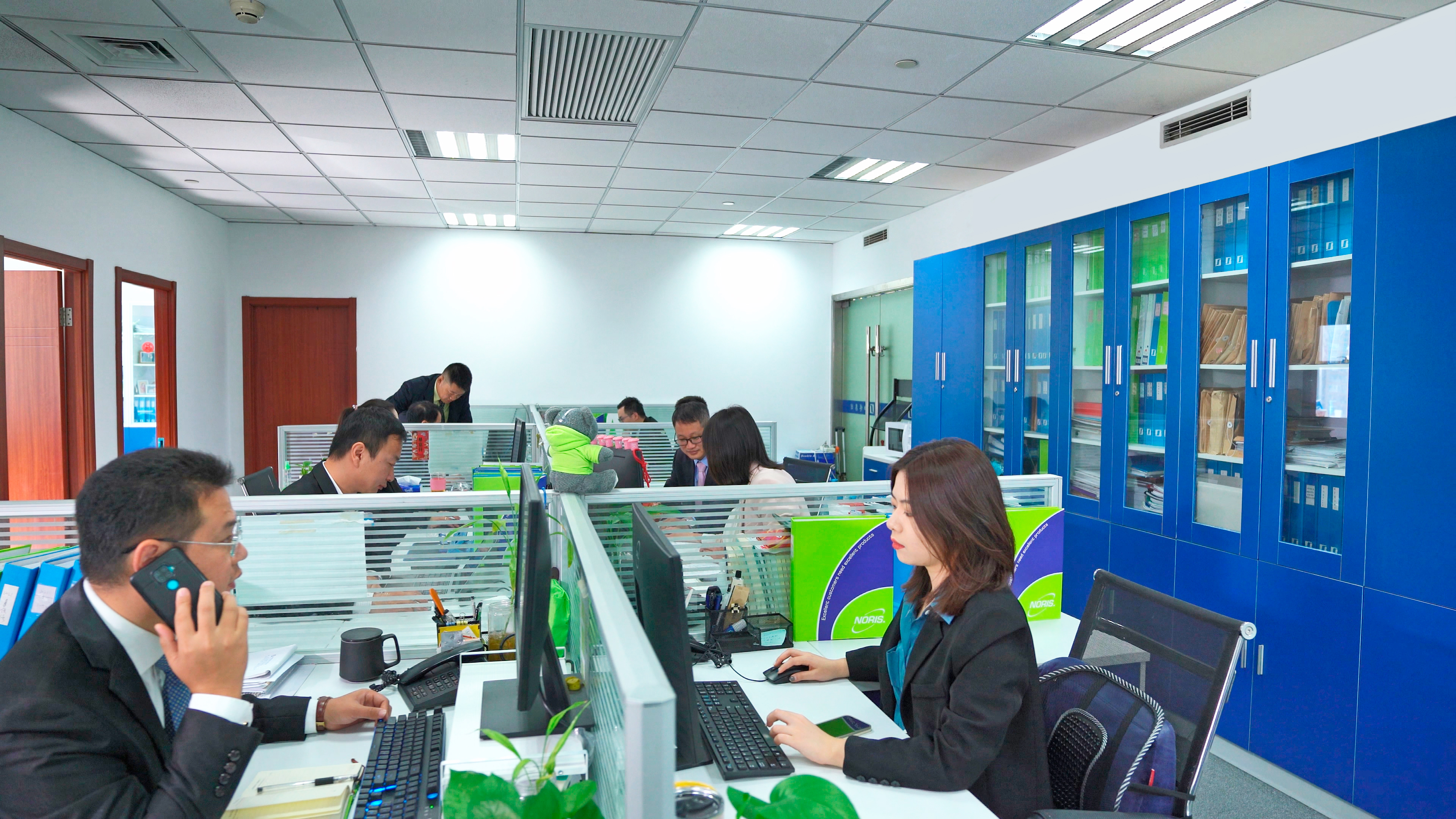 The image shows the Noris-Sibo Automation team in company office