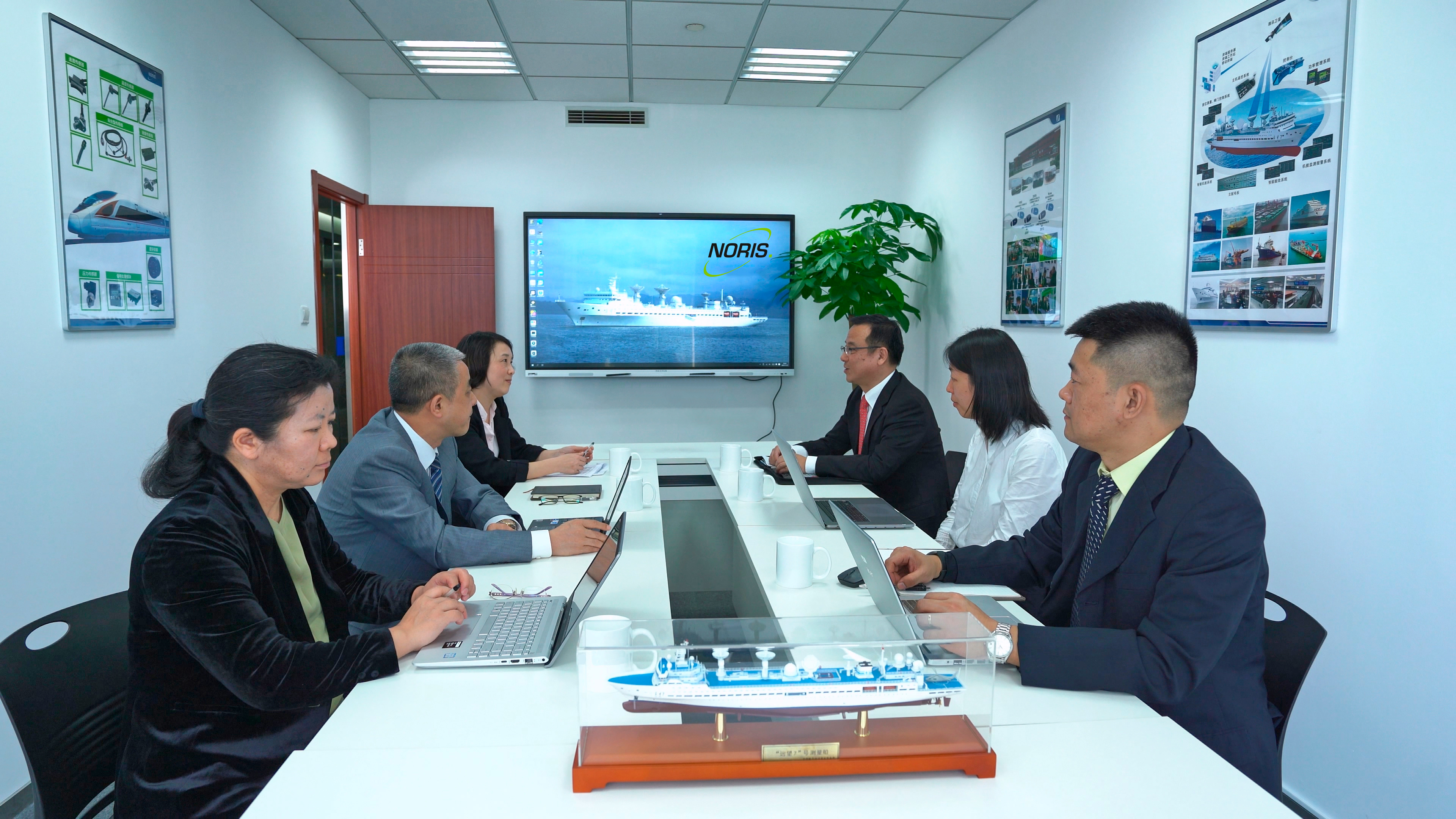 The image shows the Noris-Sibo Automation team in company office