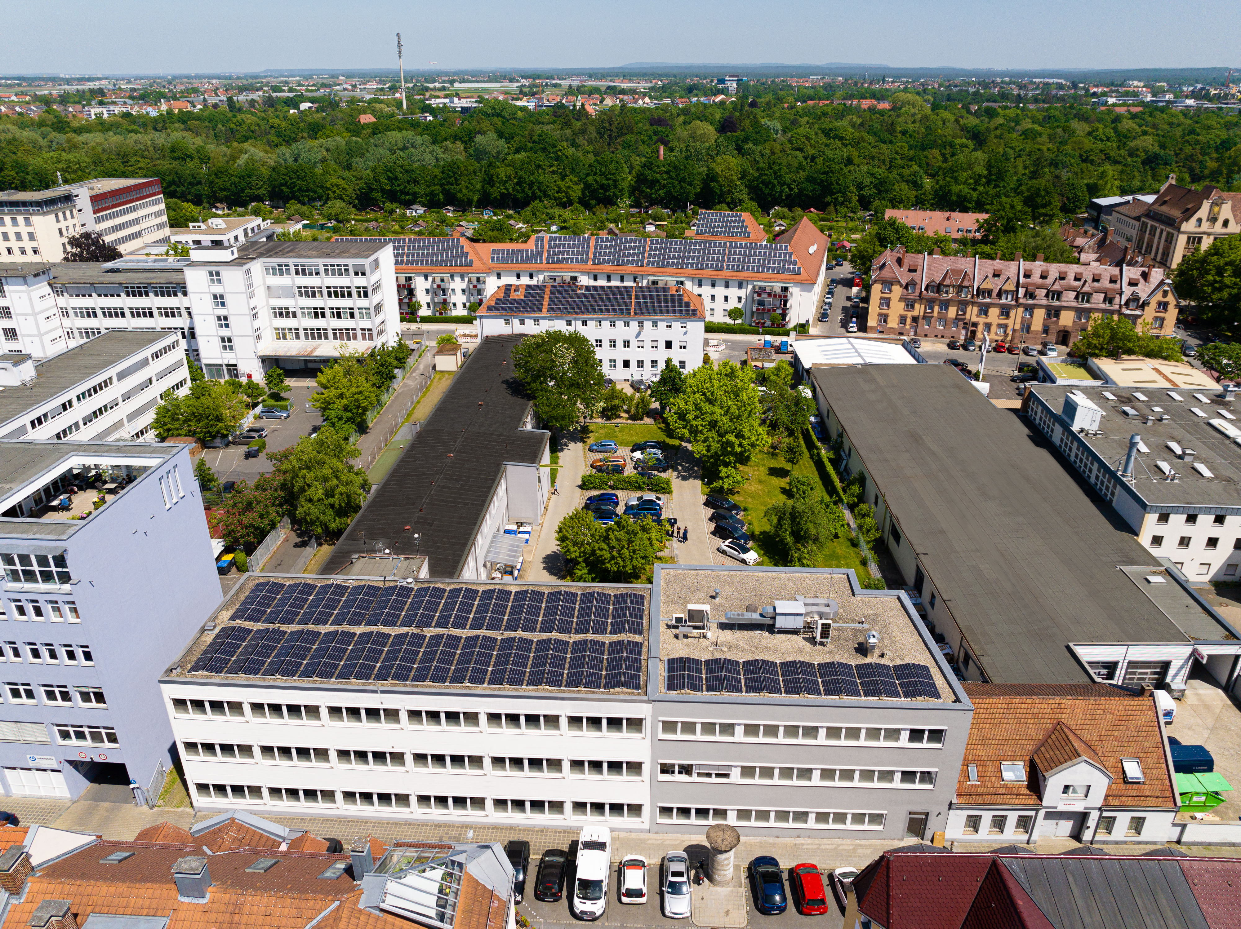 The image shows a drone view from the headquarters of Noris Group Nuremberg