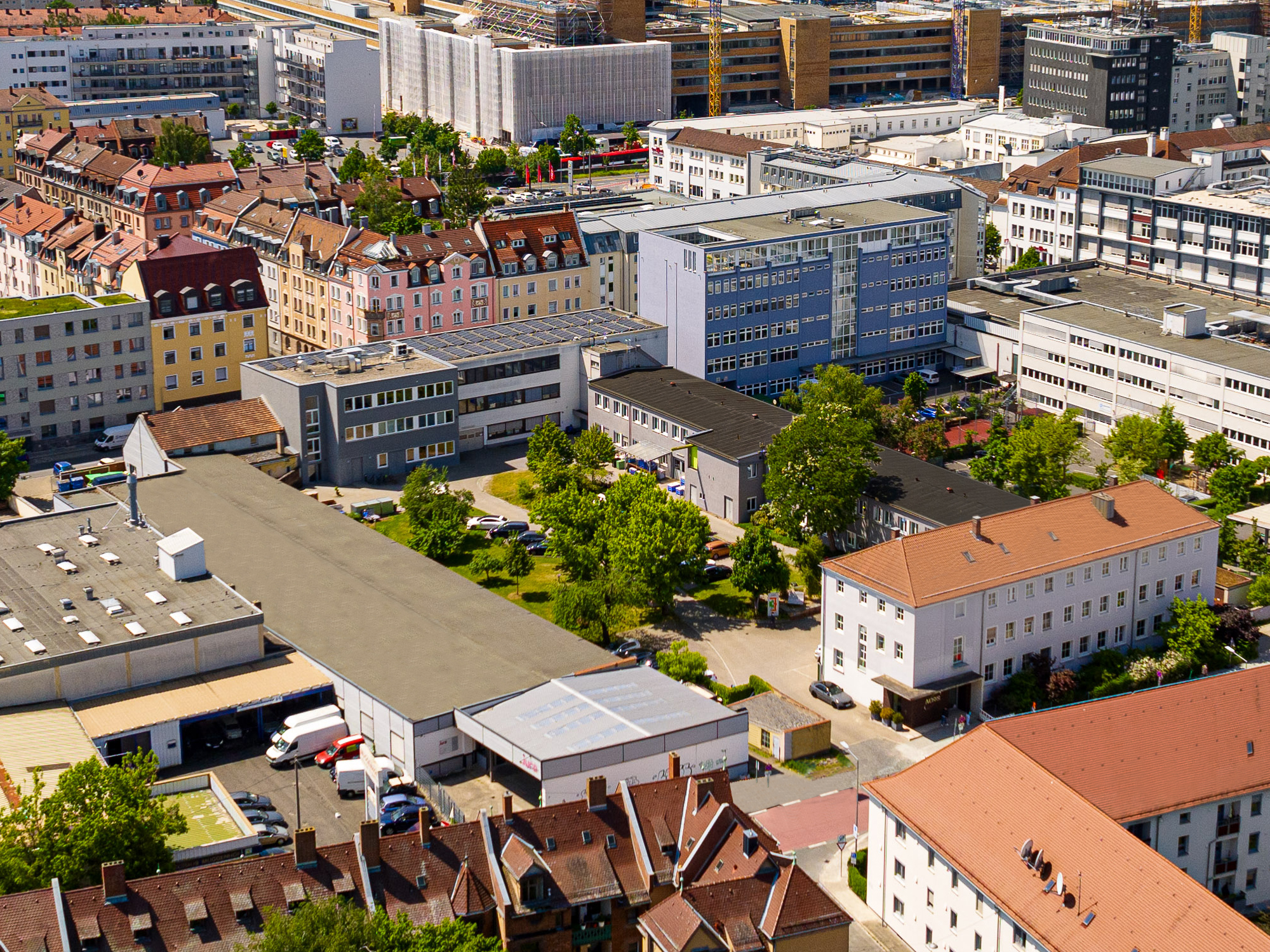 The image shows a drone view from the headquarters of Noris Group Nuremberg