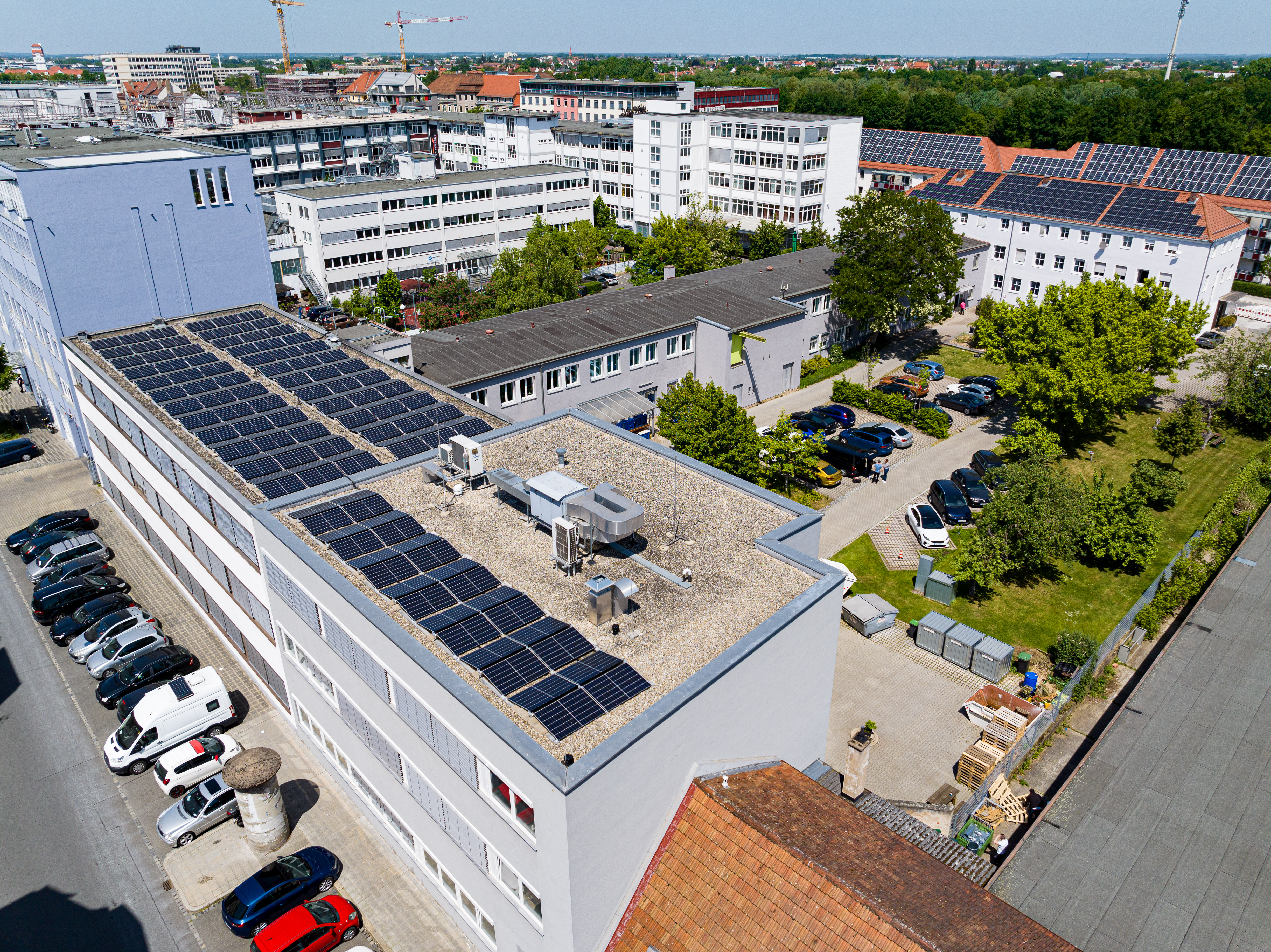 The image shows the headquarters of Noris Group Nuremberg, drone view