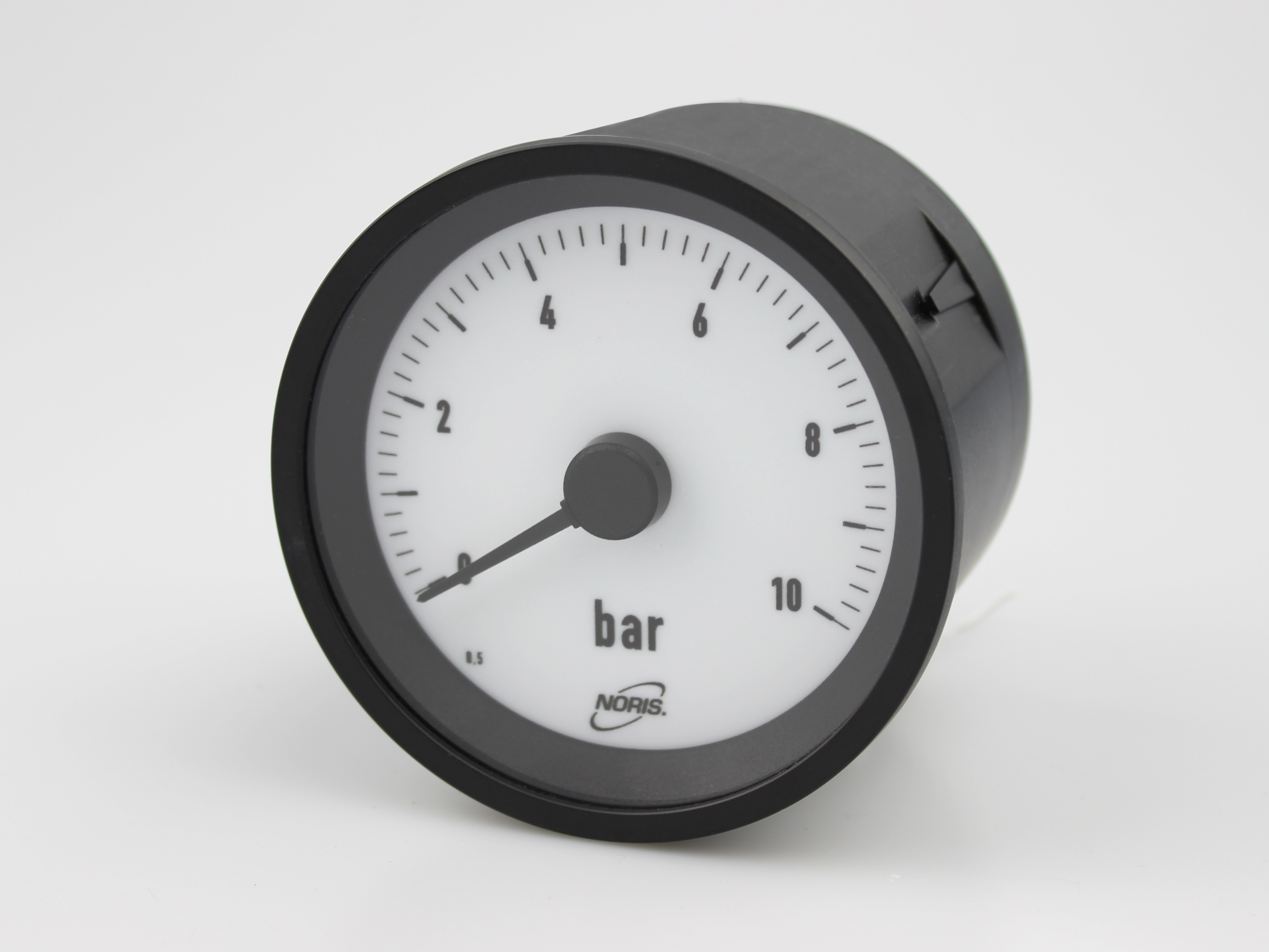 Round analogue indicator with white scale and black pointer