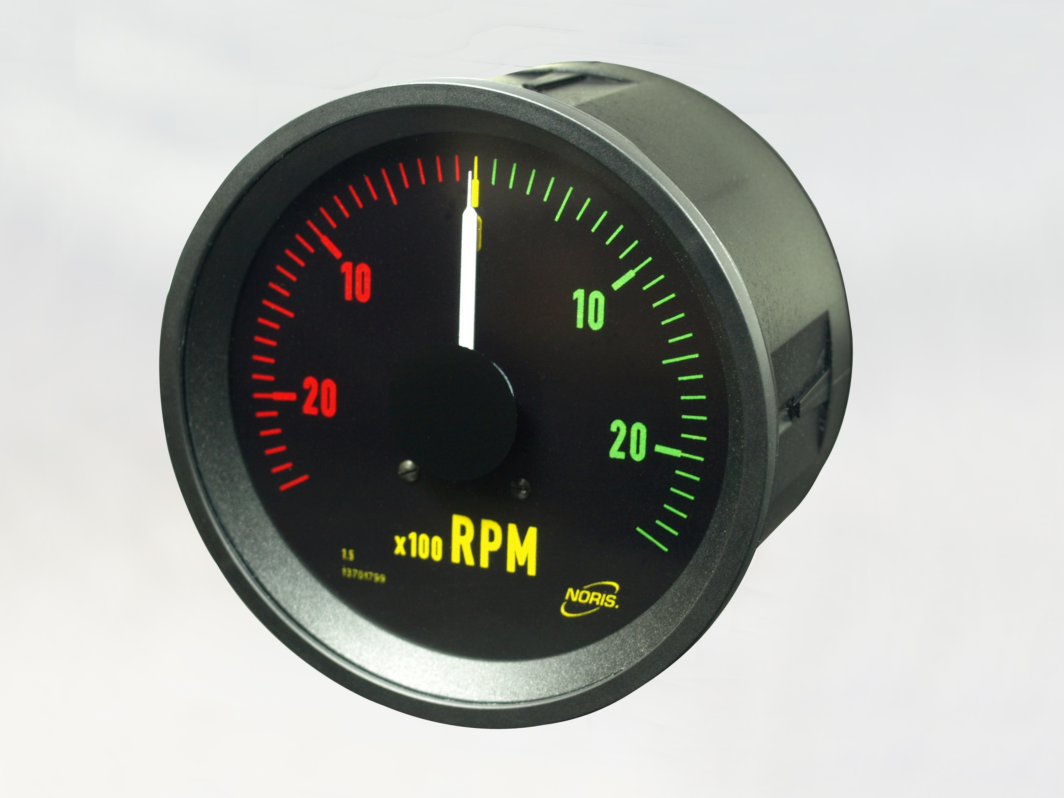 The image shows a round analogue display with a black scale with a zero position in the middle. The digits on the left-hand scale are red, the digits on the right-hand scale are green. The display measures the engine speed.