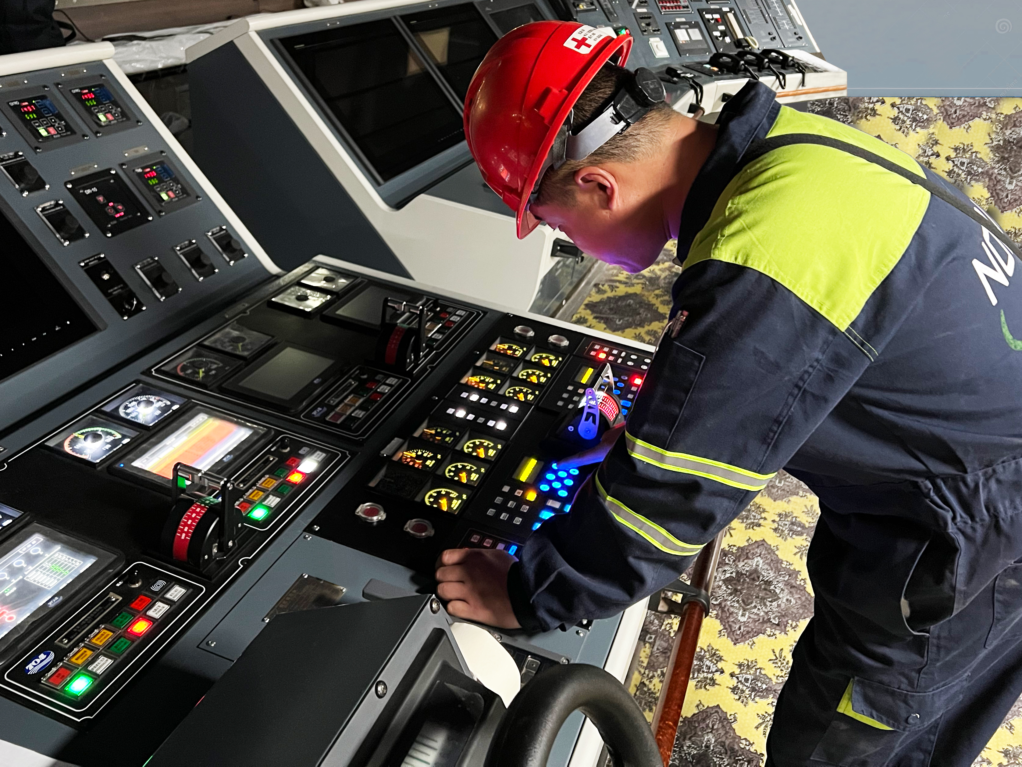 The image shows a big bridge panel with a control panel of Noris. A Noris service technician is testing the panel