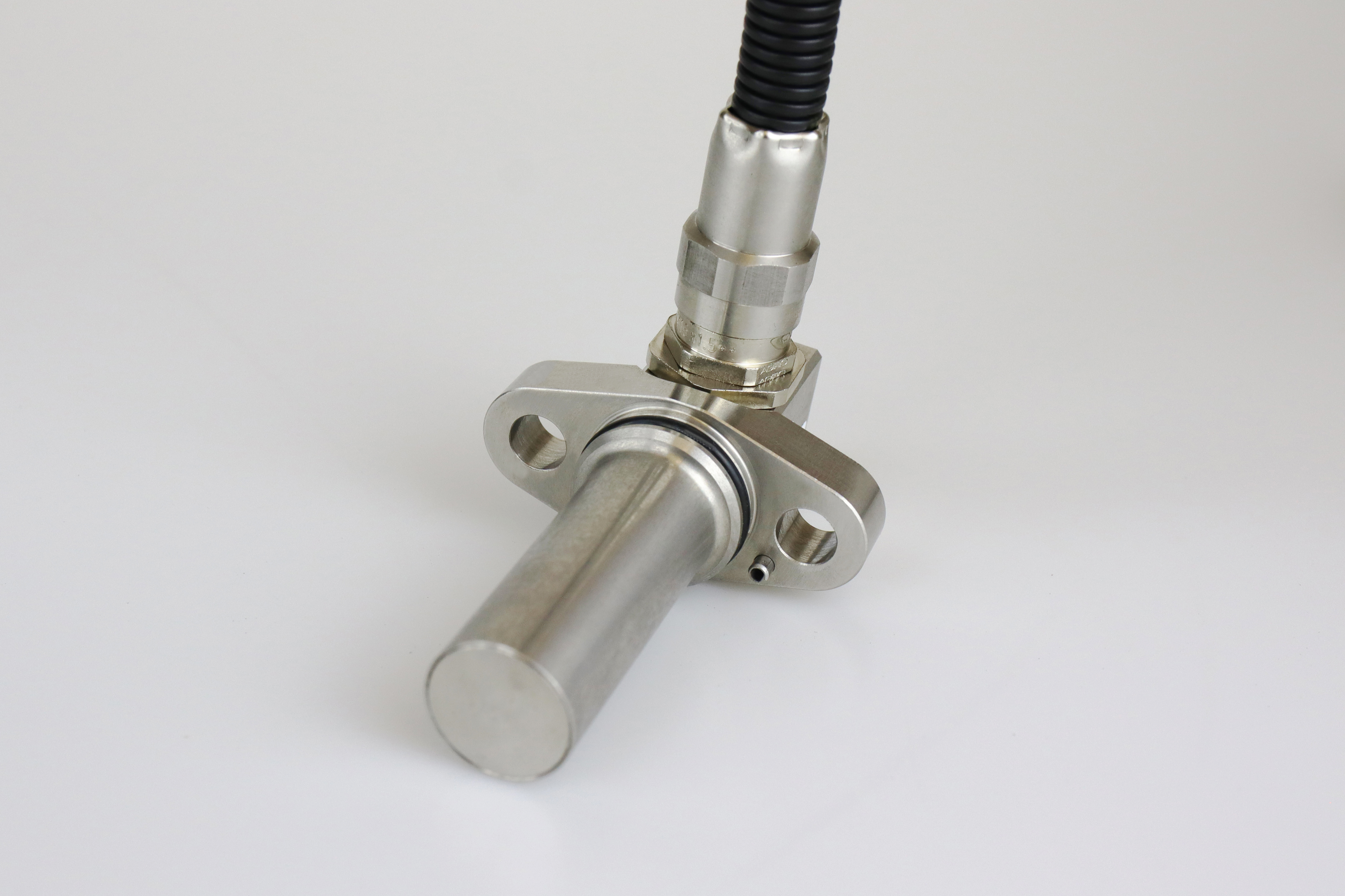 The image shows a Stainless steel flange speed sensor type FA52 laying on a grey background